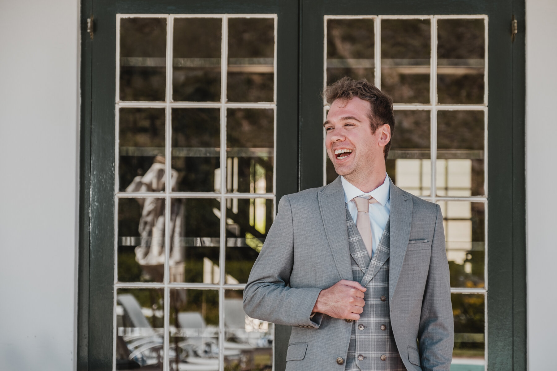 Groom Stuart having a ball with his portraits before the wedding.