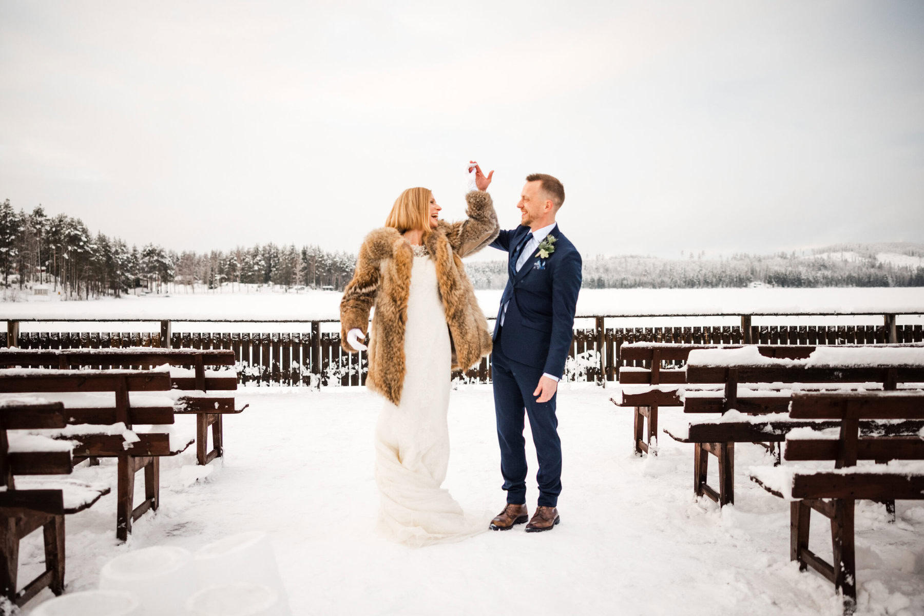 Winter wedding by snowy lake