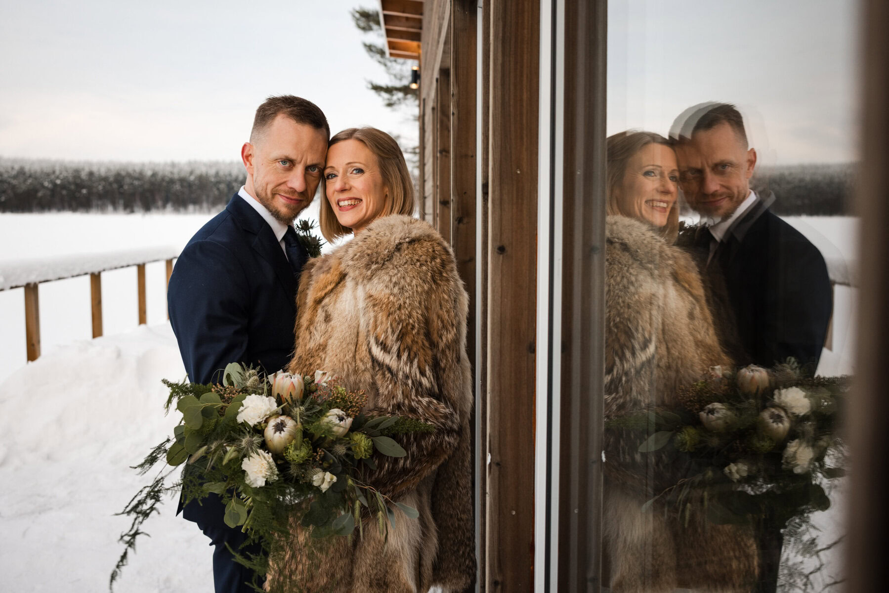 Couple in winter wedding attire.